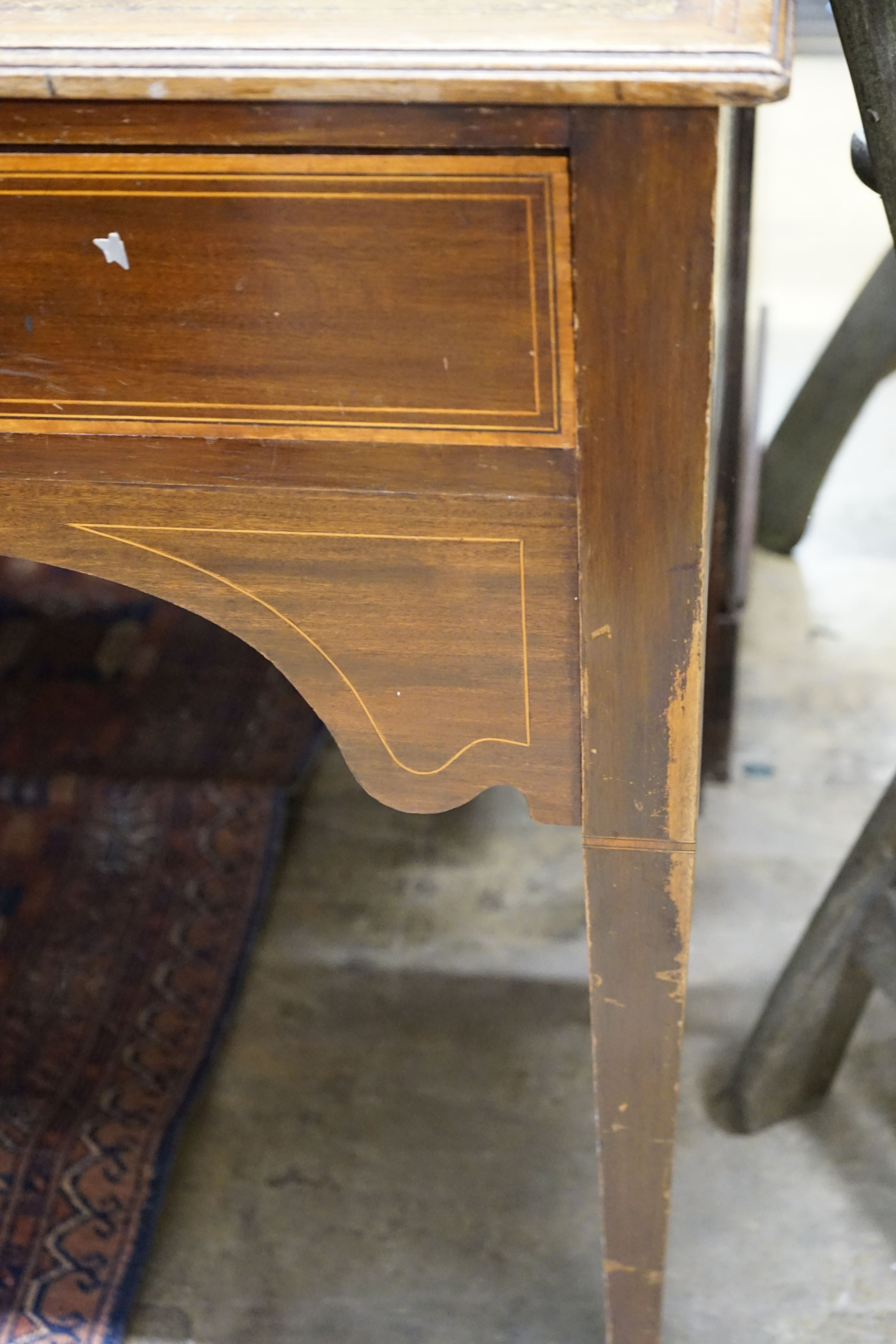 An Edwardian satinwood banded mahogany writing table, width 115cm, depth 53cm, height 72cm